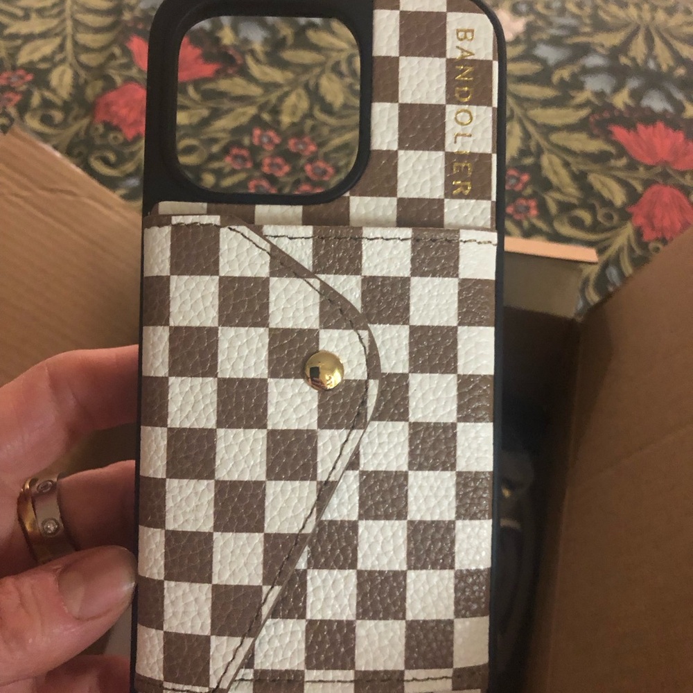 New Bandolier iPhone 14 pro case. Louis Vuitton design. Brand new. Never opened.